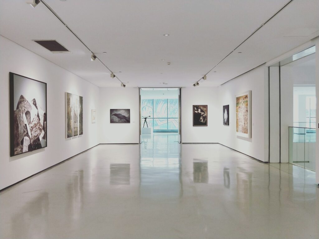 Photo by Dannie Jing assorted paintings on white painted wall