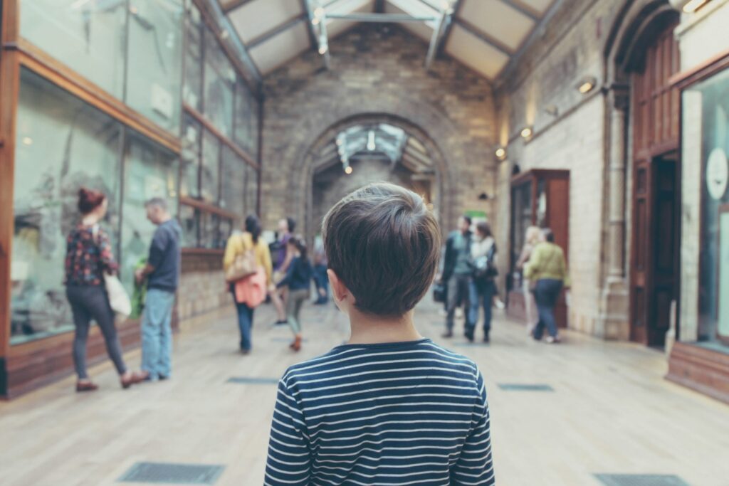 Photo by Michał Parzuchowski boy standing inside closed room